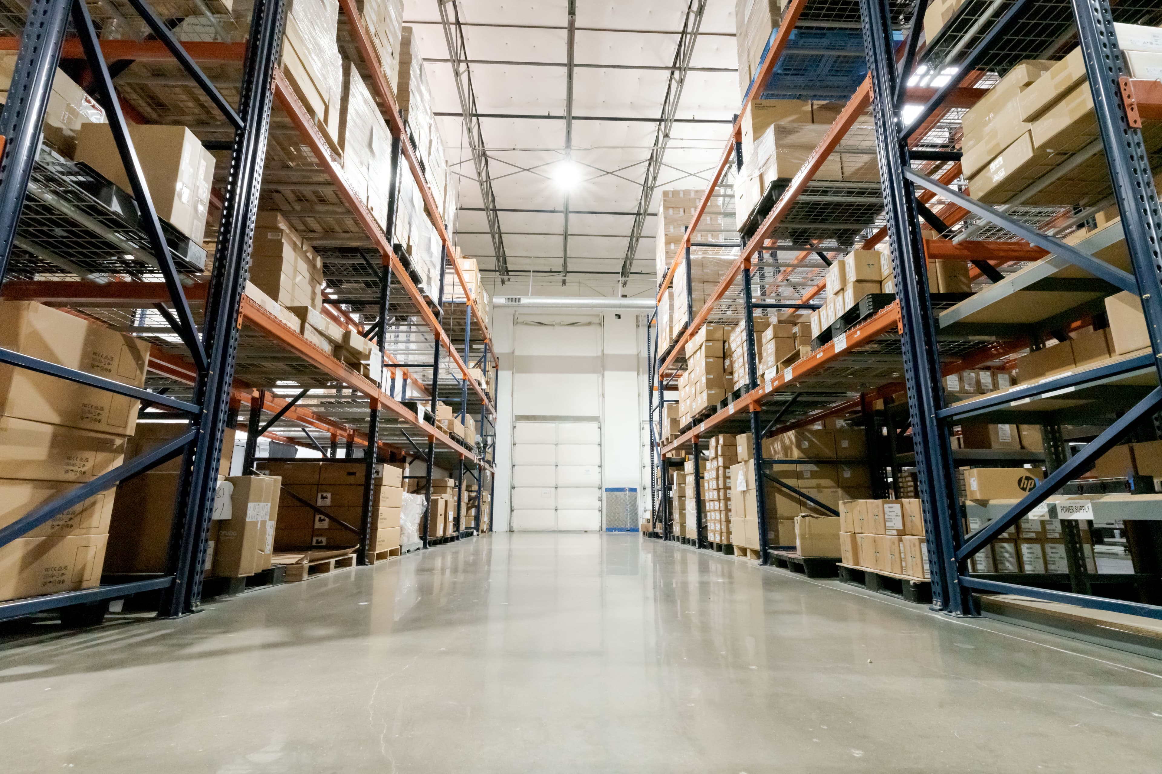 Wide aisle of pallet racking inside Fornida's hardware warehouse
